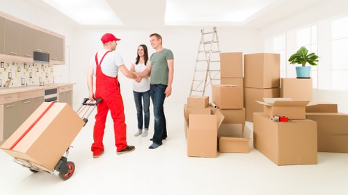 Boxes and office furniture prepared for a business move in Hornsey