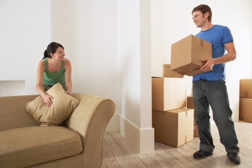 Local movers handling bulky furniture in a Hornsey property
